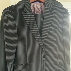 Two men’s suits new with tags